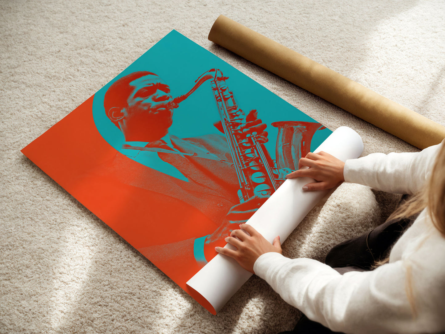 Person unrolling a poster of a saxophonist with a red and blue design on a beige carpet.