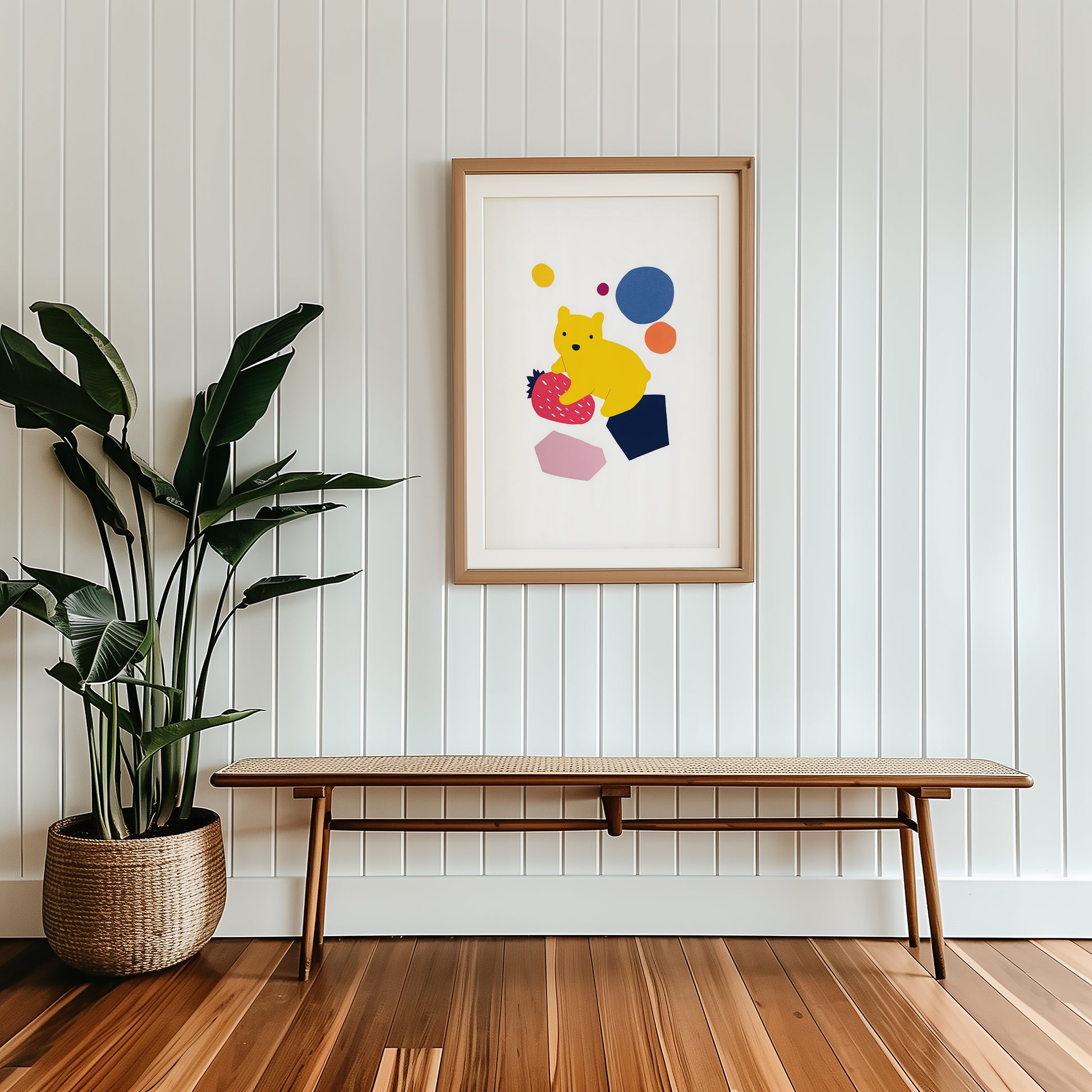 Bear nursery wall art print displayed in wooden frame featuring yellow bear sitting on a strawberry with colourful abstract shapes.