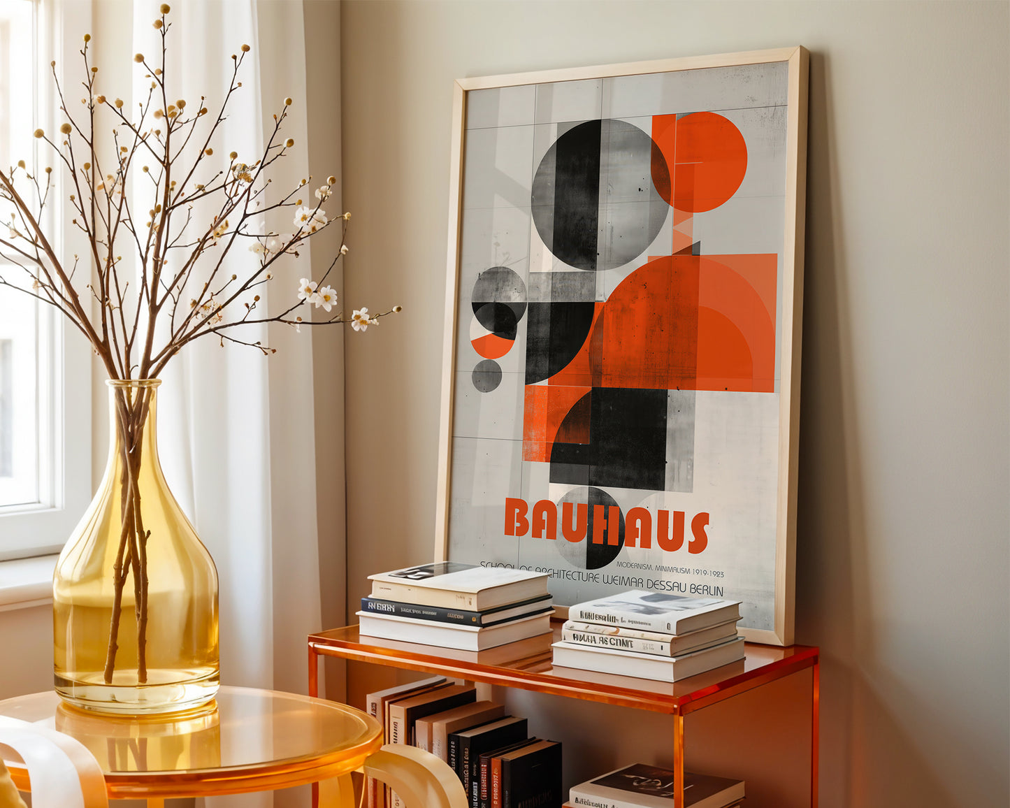 Framed Bauhaus poster on a shelf with books and a vase in a room.