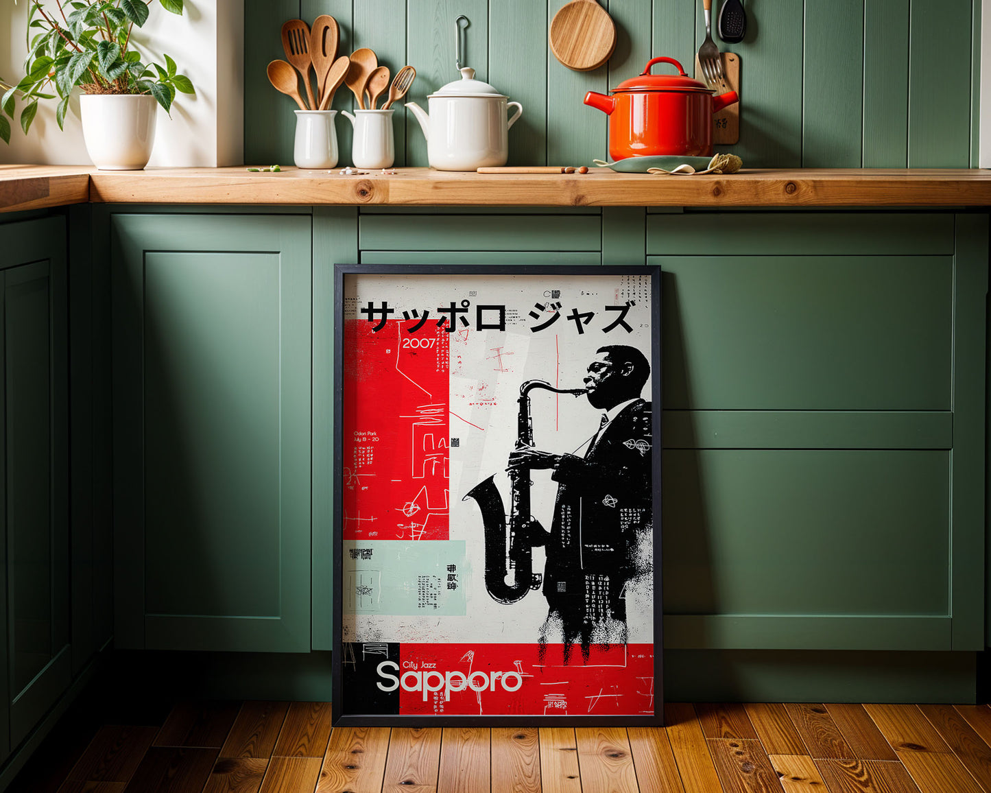 Poster of a saxophonist on a kitchen wall with green cabinets and wooden countertops.