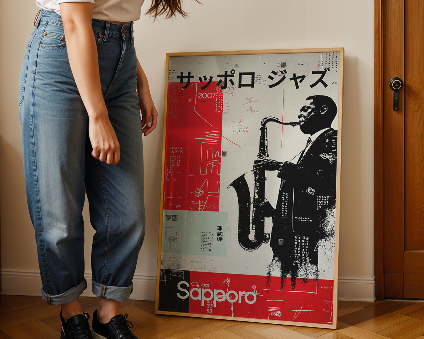 Person standing next to a framed poster of a saxophonist with 'Sapporo' branding.