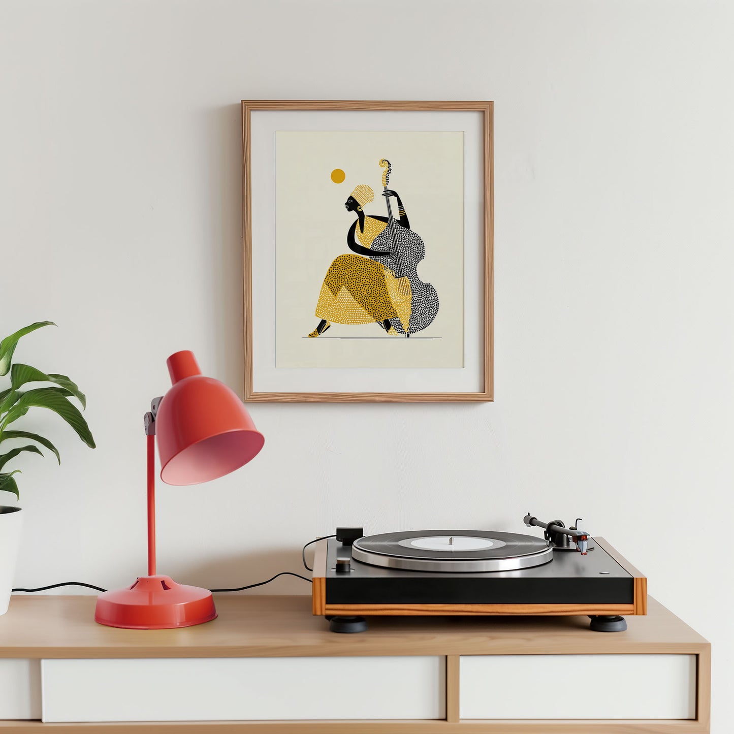 Turntable on a wooden shelf with a red lamp and framed artwork of a musician playing a double bass.