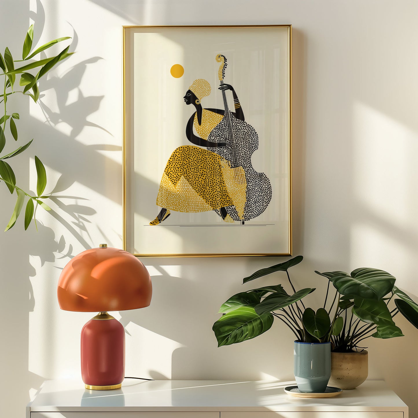 Framed artwork of a musician playing a double bass on a wall with a lamp and plants below.