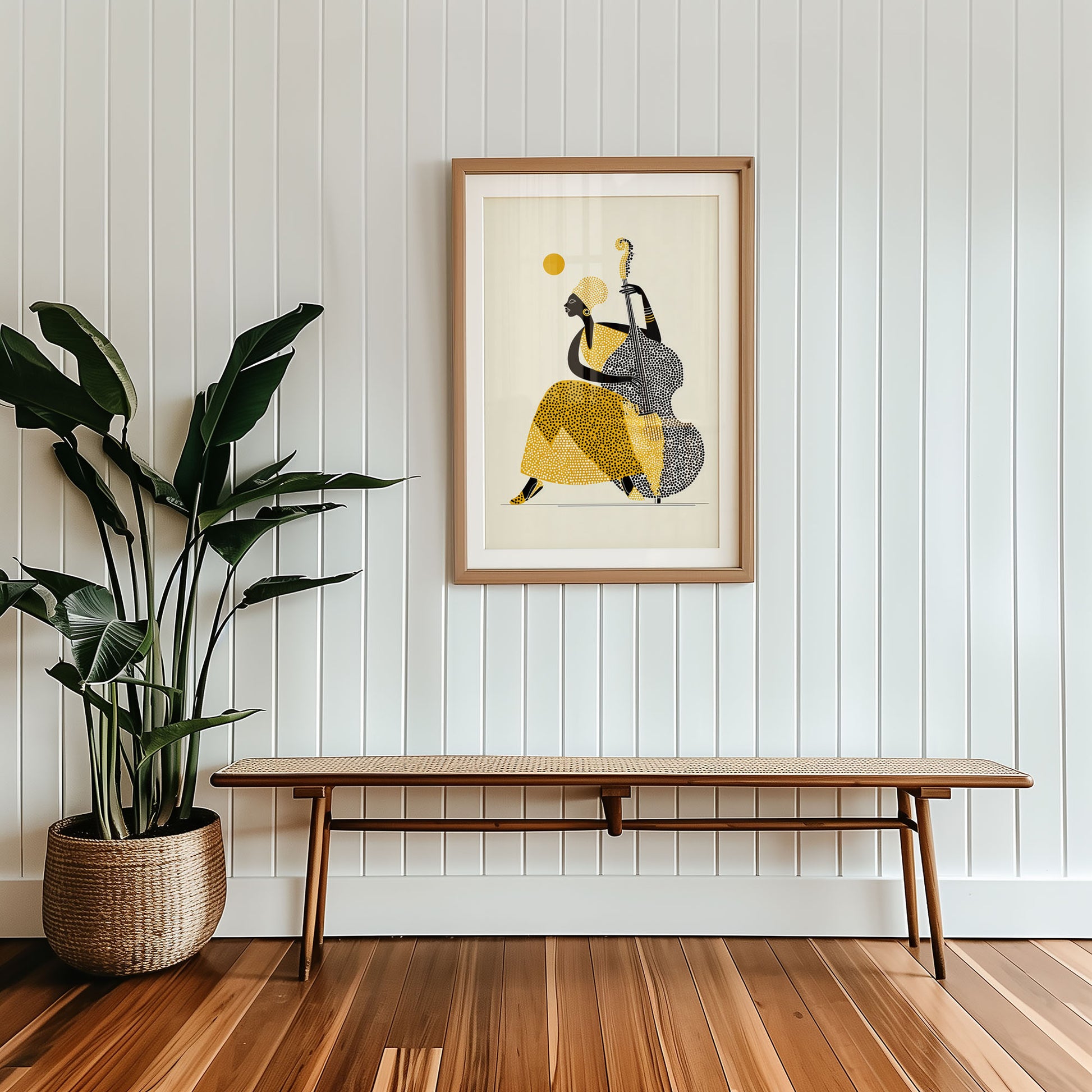 Framed abstract art on a wall with a wooden bench and plant below.