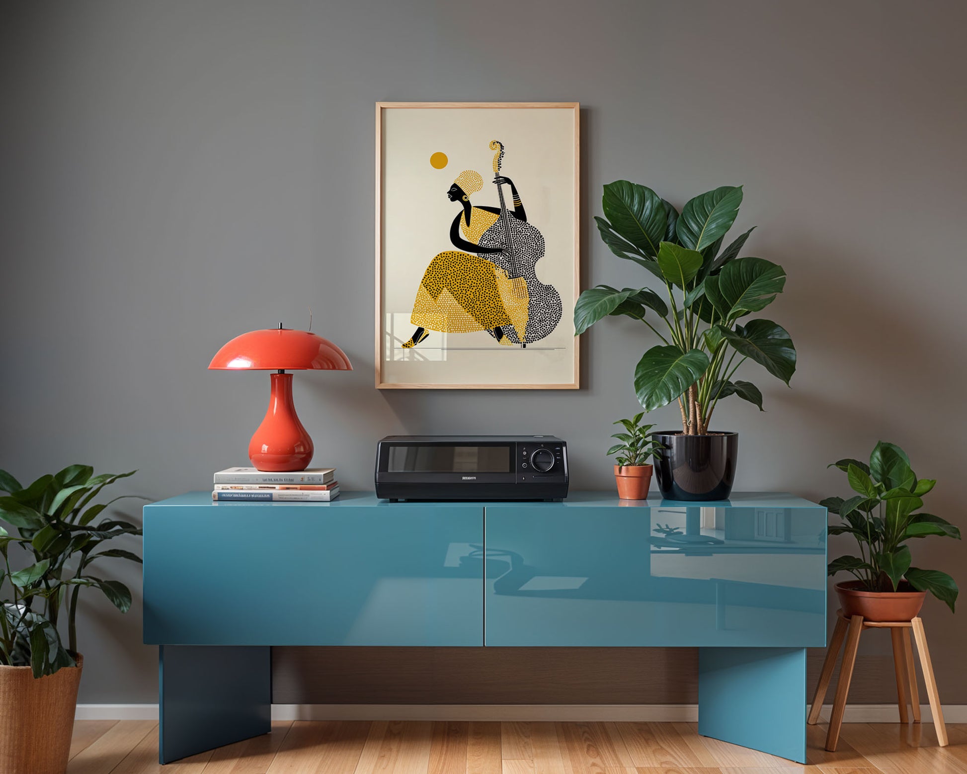 Modern interior with a blue console table, red lamp, and framed artwork on a gray wall.