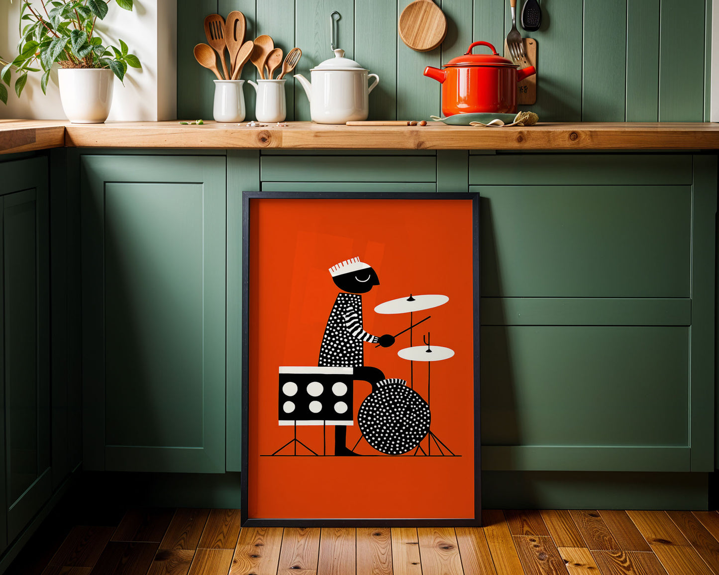Framed artwork of a drummer on an orange background in a kitchen setting.