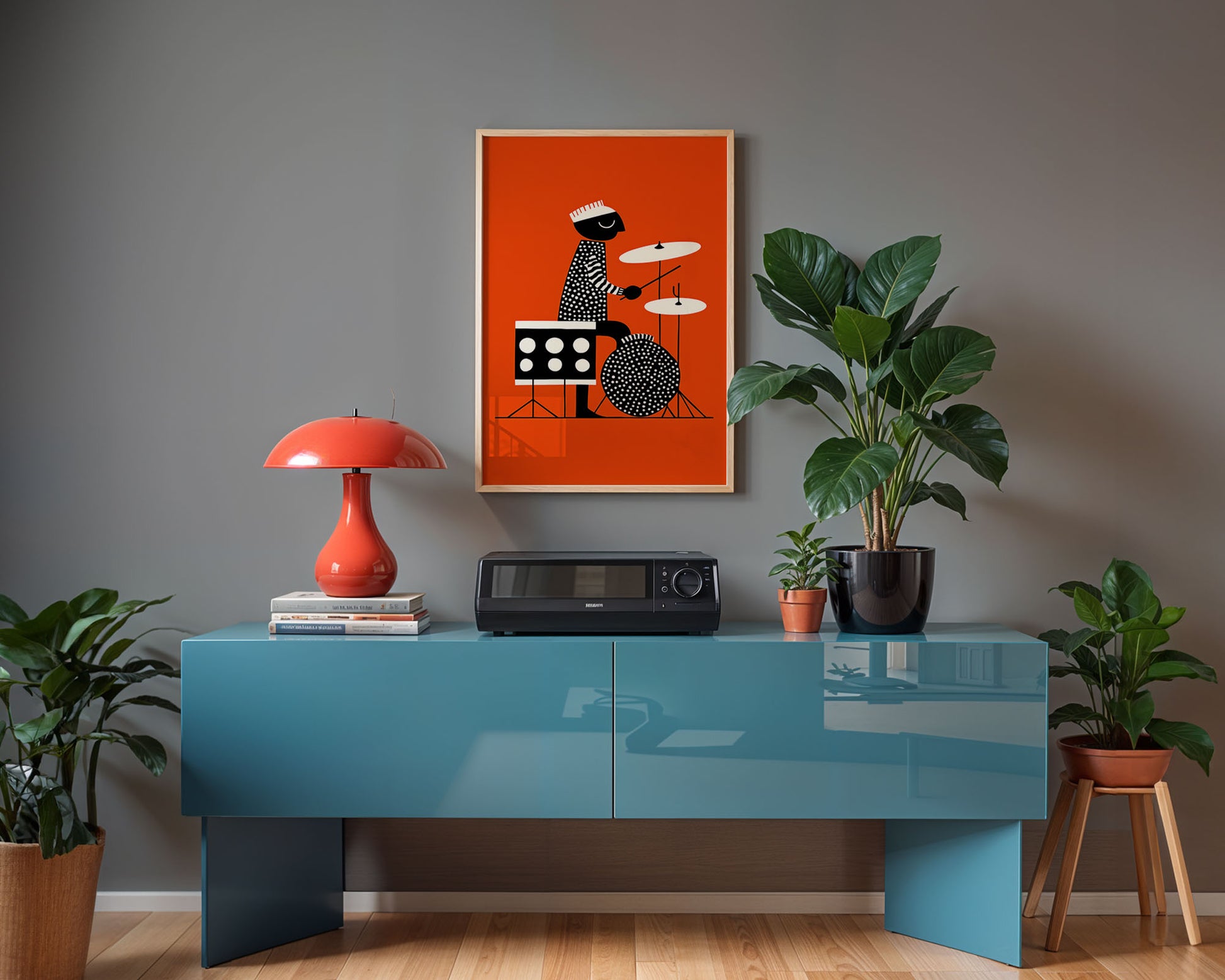 Modern interior with a blue console table, red lamp, and framed artwork on a gray wall.