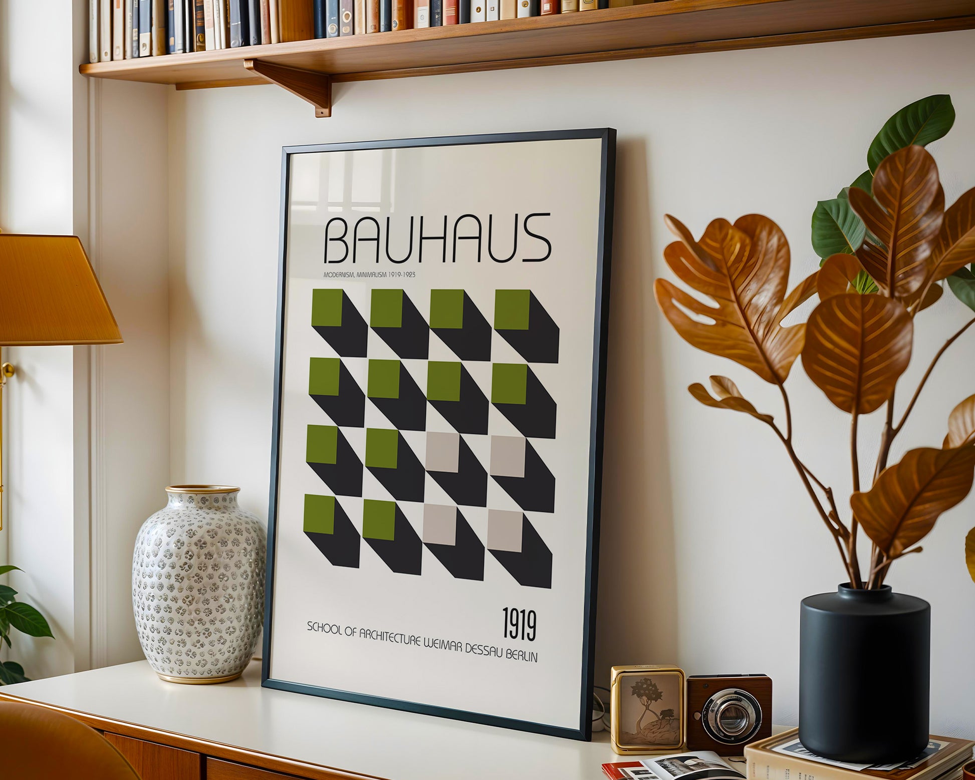 Bauhaus 1919 geometric wall art framed in light wood, displaying green and black abstract cube design in minimalist interior.