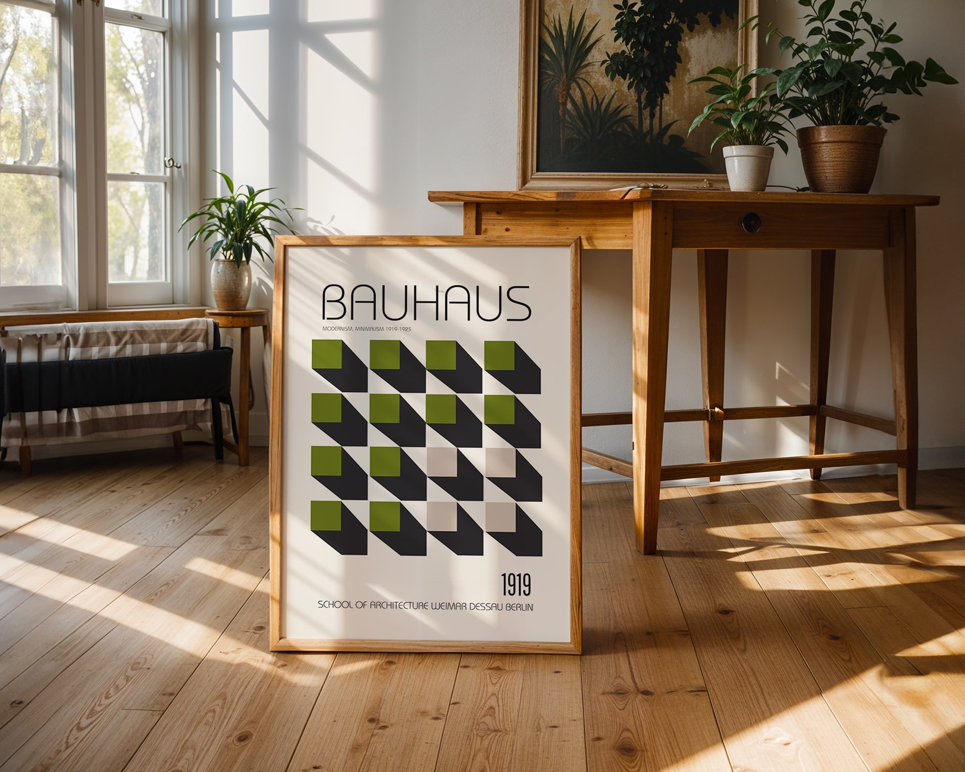 Framed Bauhaus poster on a wooden floor with a table and plants in the background
