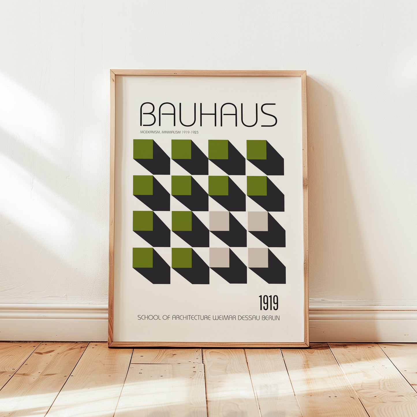 Bauhaus 1919 modernist poster print featuring geometric green and black cube pattern on a cream background with minimalist typography.