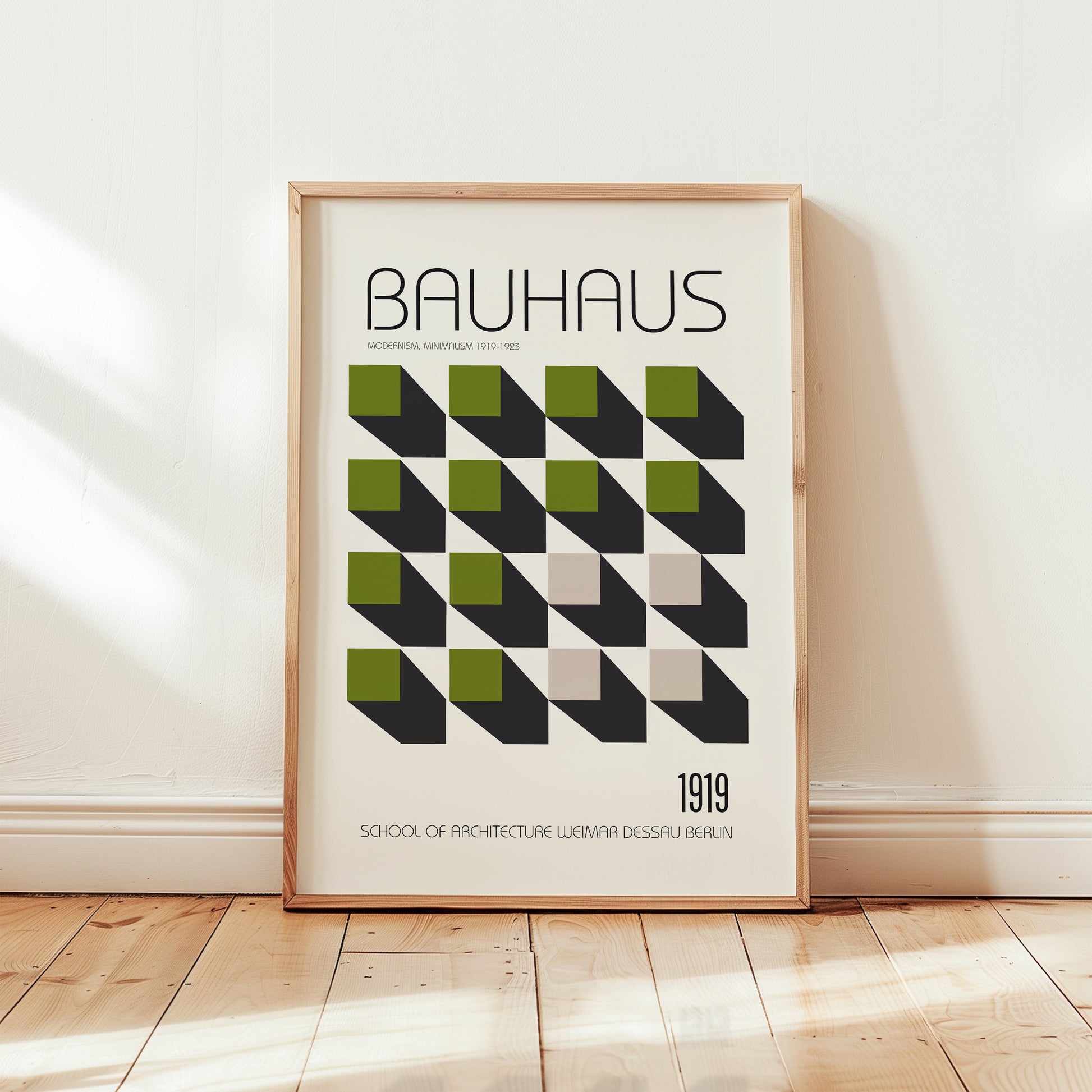 Bauhaus 1919 modernist poster print featuring geometric green and black cube pattern on a cream background with minimalist typography.
