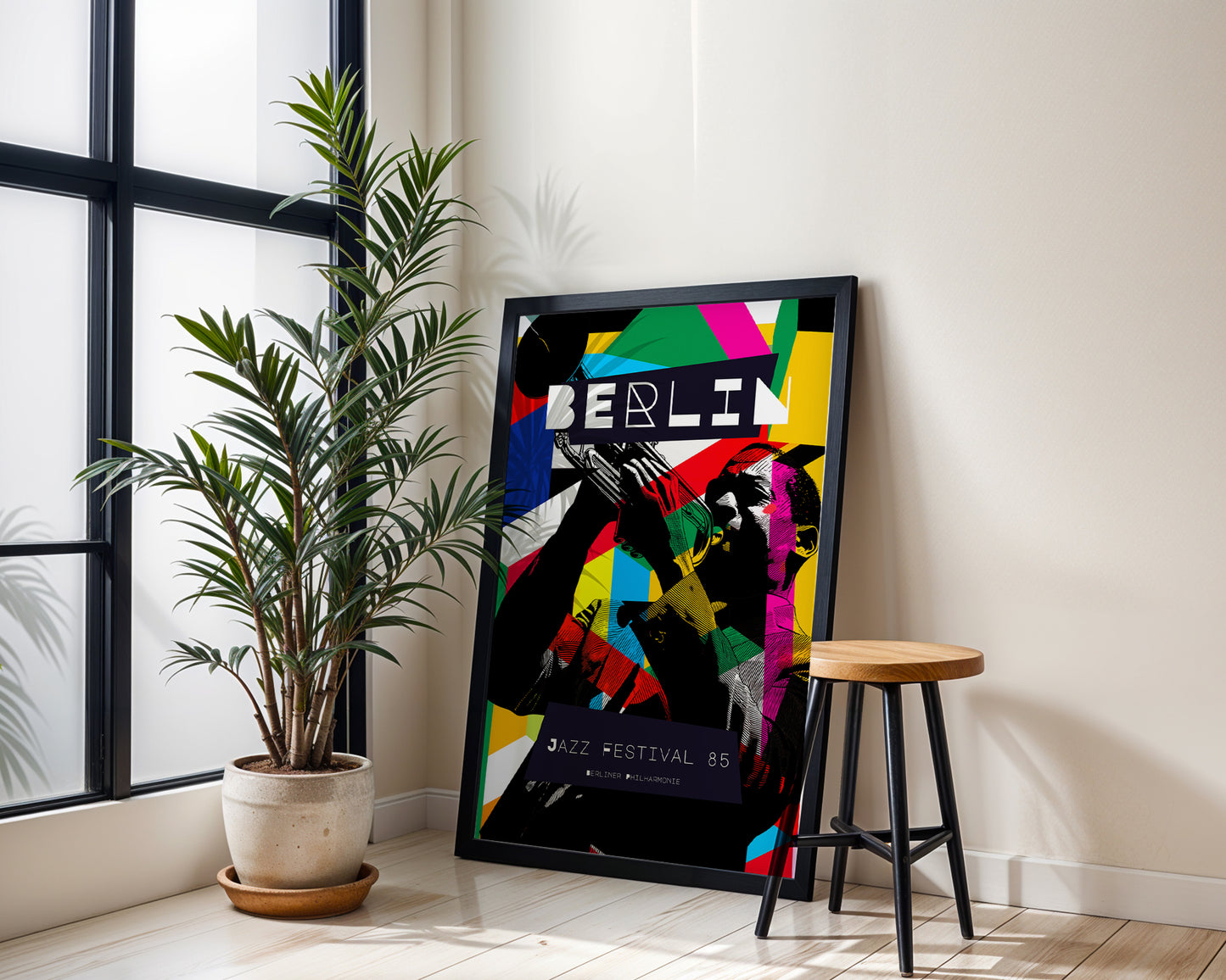 Colorful 'BERLIN' poster on a wall next to a plant and stool