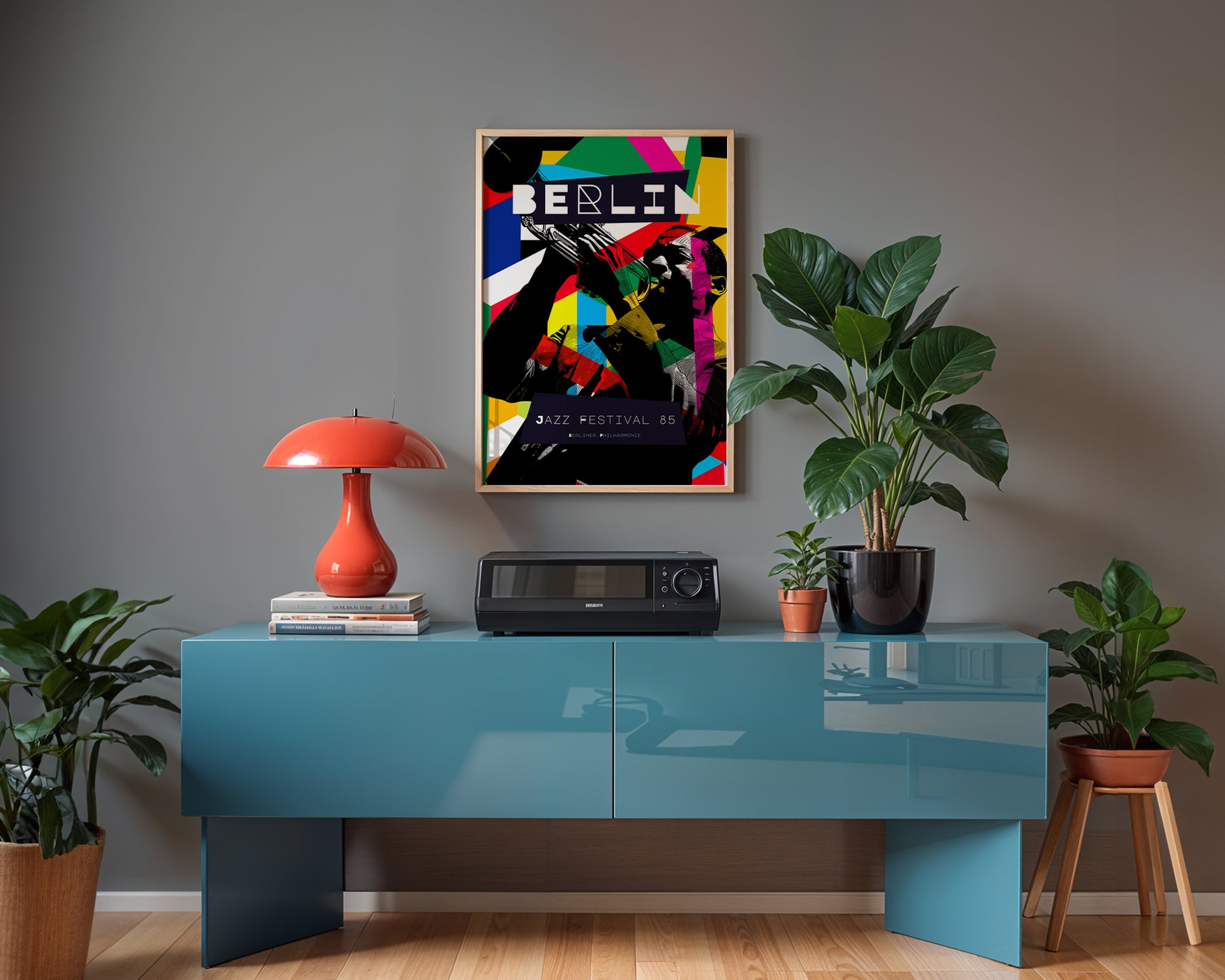 Modern interior with a blue console table, red lamp, and colorful 'Berlin' poster on a gray wall.