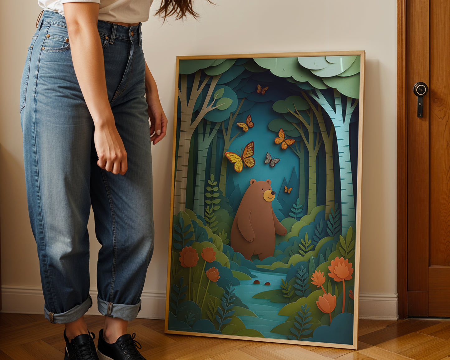 Woodland bear nursery wall art print displayed in wooden frame featuring forest scene with butterflies and layered paper-cut illustration.