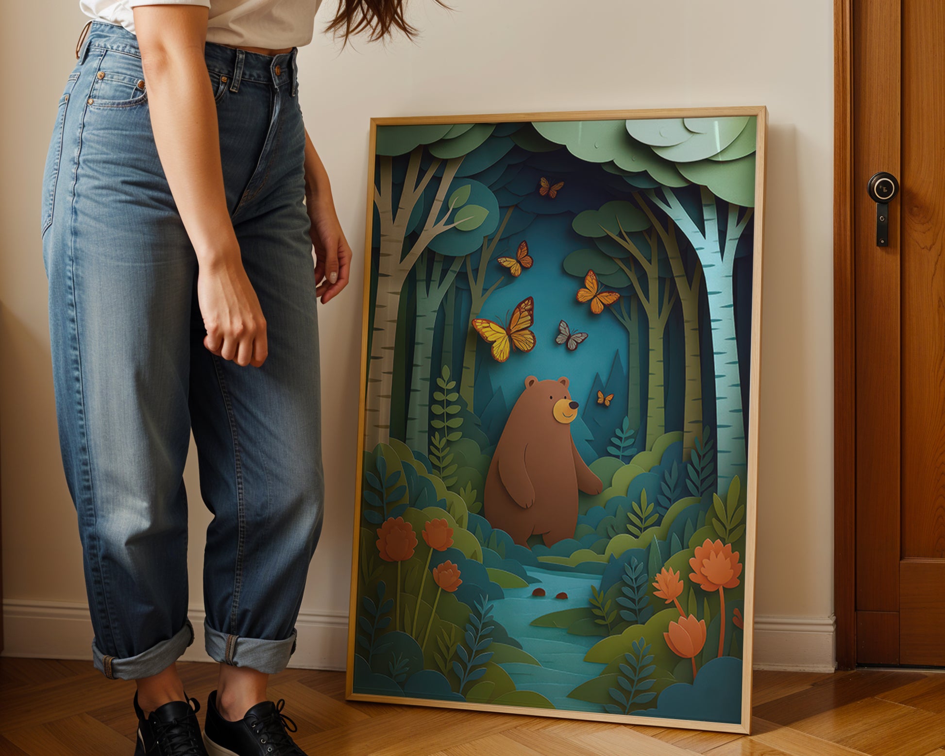Woodland bear nursery wall art print displayed in wooden frame featuring forest scene with butterflies and layered paper-cut illustration.