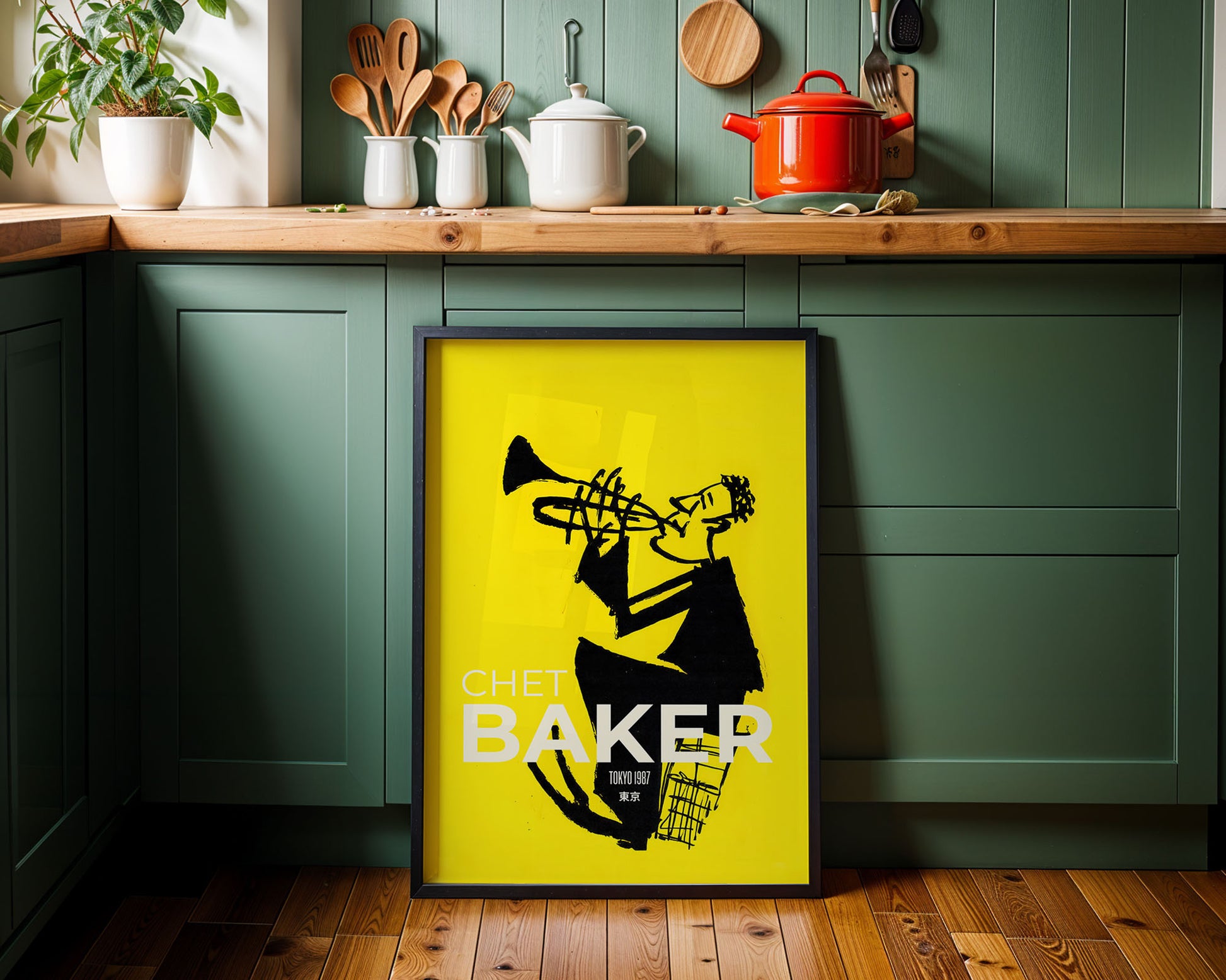 Yellow framed poster with a black silhouette of a saxophonist and 'Chet Baker' text in a kitchen setting.