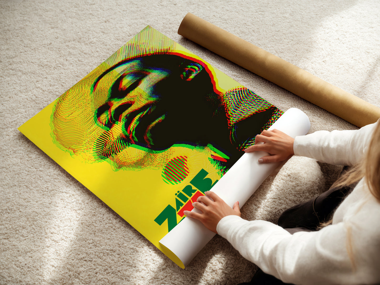 Person unrolling a colorful yellow Fela Kuti poster .