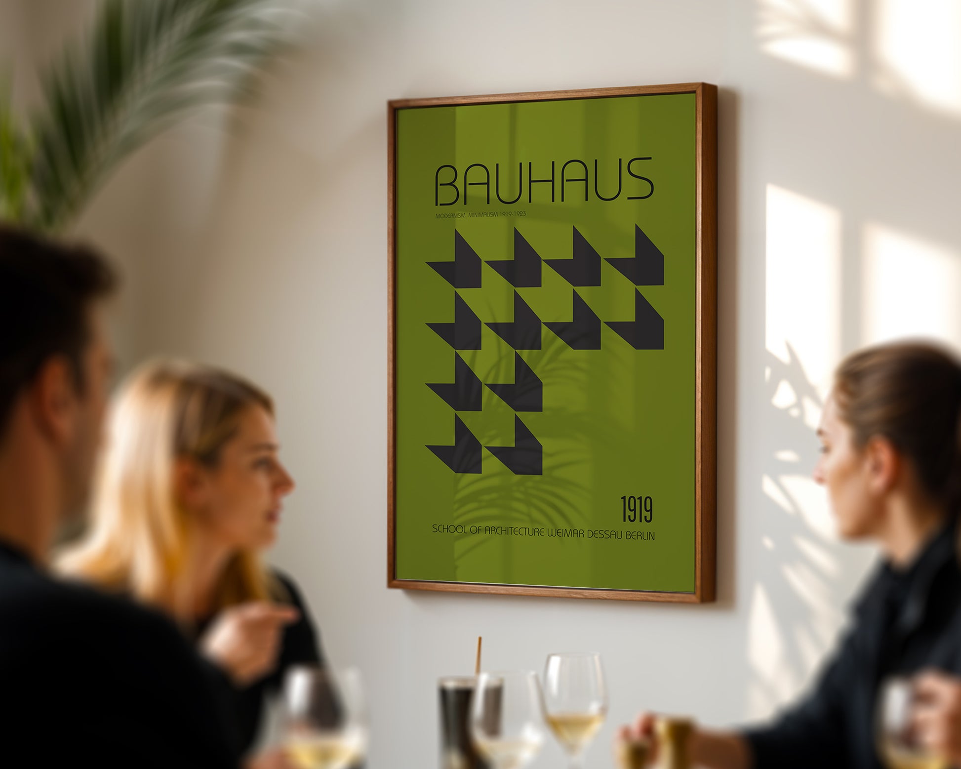 Green Bauhaus poster on a wall with people in the foreground