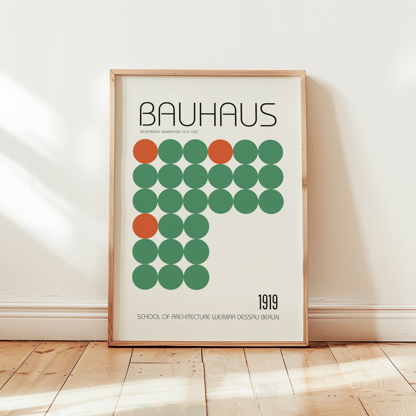 Bauhaus 1919 modernist poster print featuring a grid of green circles with bold orange accent dots on a cream background and minimalist typography.