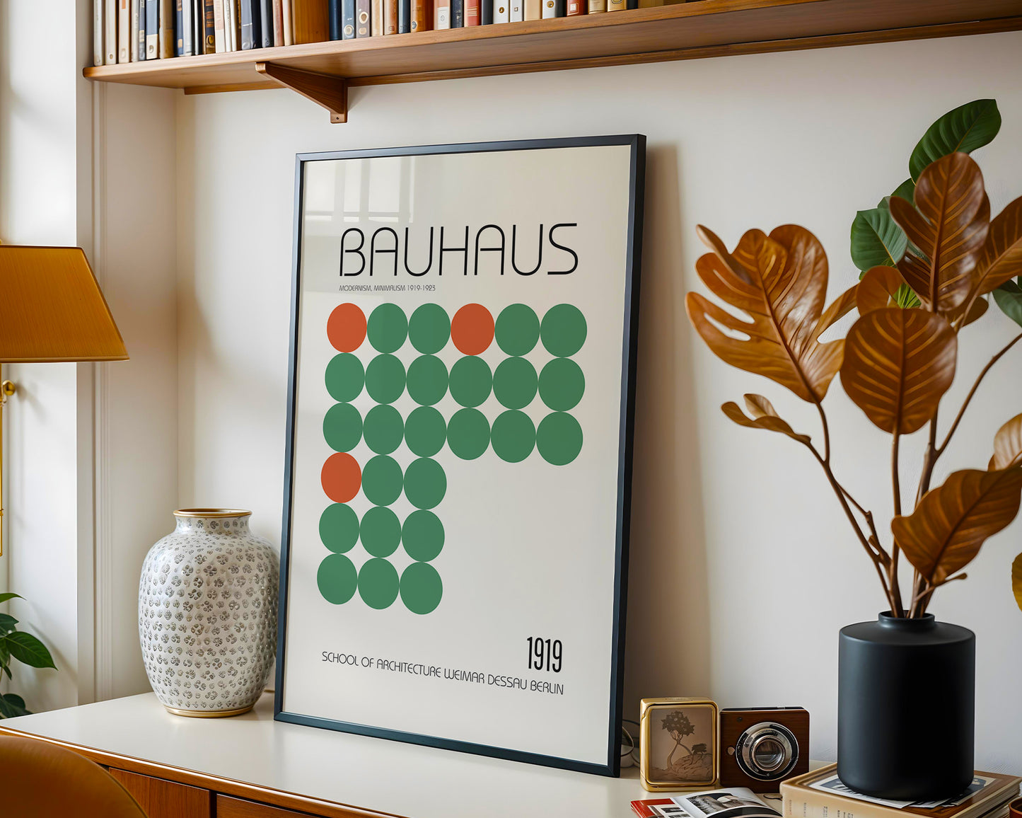 Framed Bauhaus poster on a shelf with decorative items