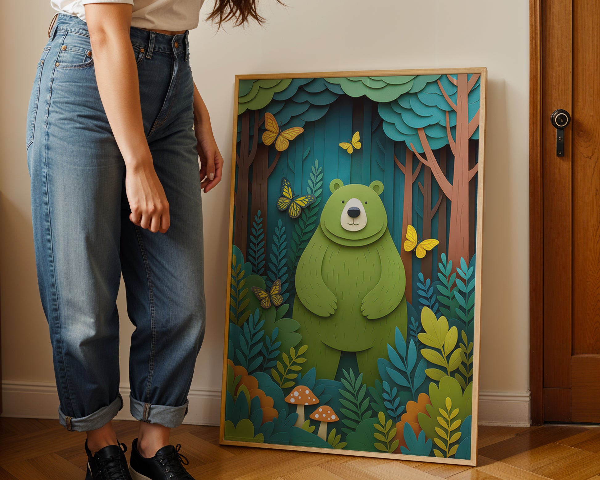 young mother  standing next to a framed artwork of a bear in a forest