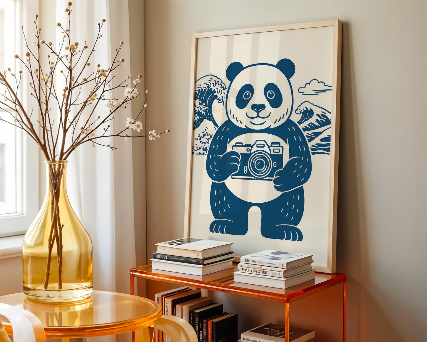 Framed artwork of a panda holding a camera on a shelf with books and a vase.