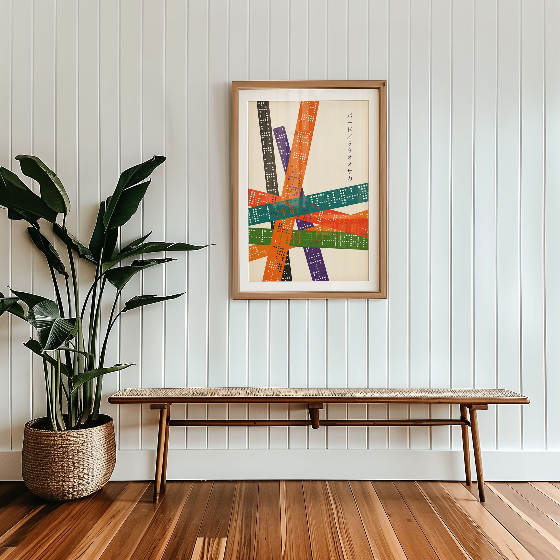 Framed mid-century style wall art print styled against minimalist interior wall