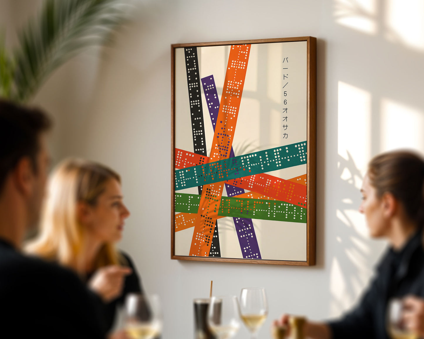 Colorful abstract artwork on a wall with people in the foreground