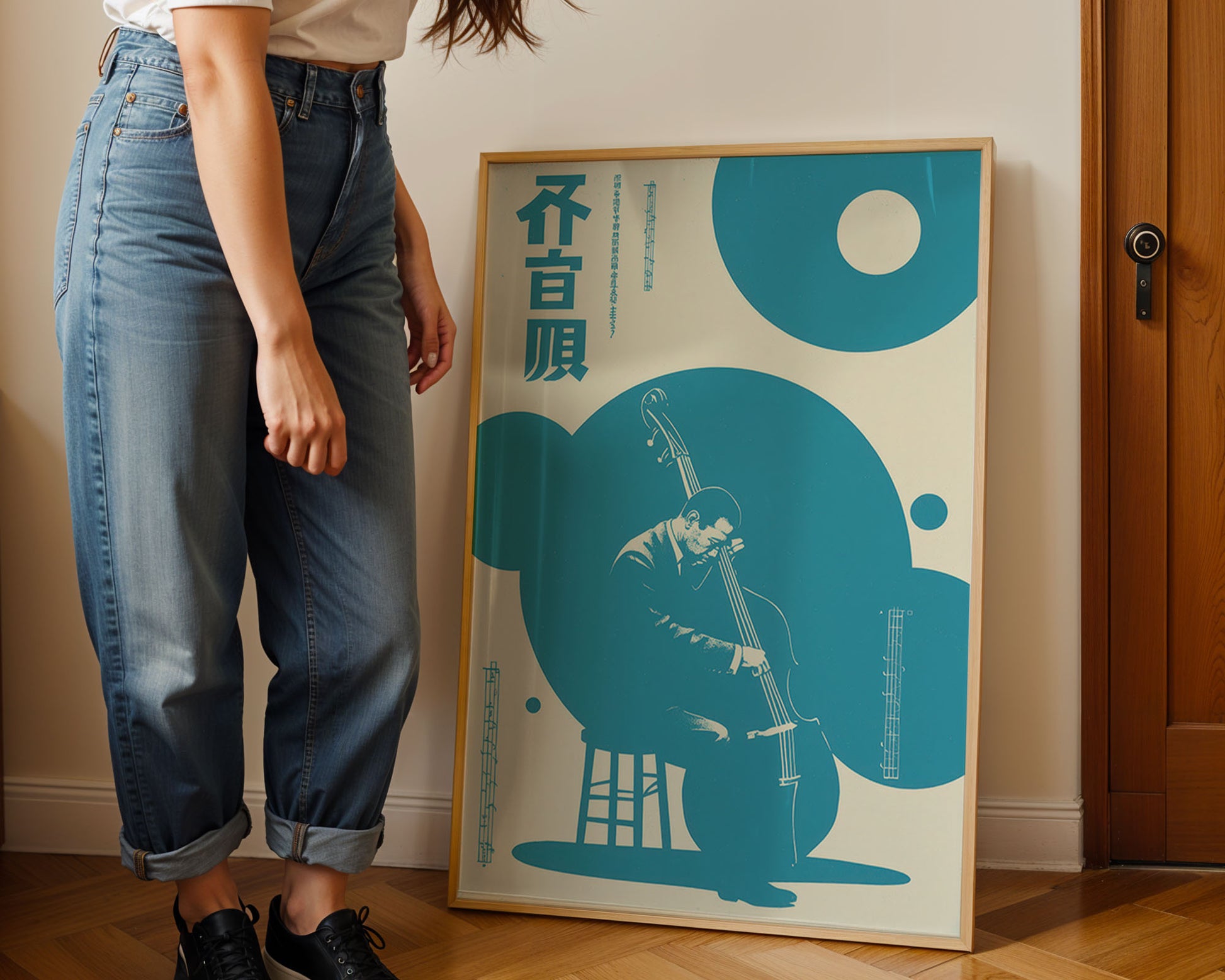 Person standing next to a framed Jazz poster with abstract design and text on a wall.