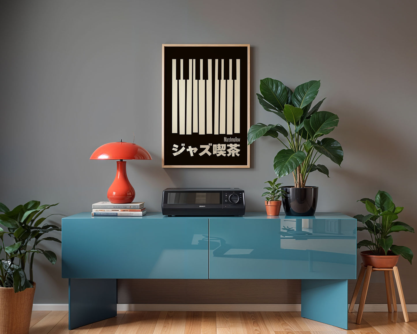 Modern interior with a blue console table, red lamp, and plants against a gray wall.