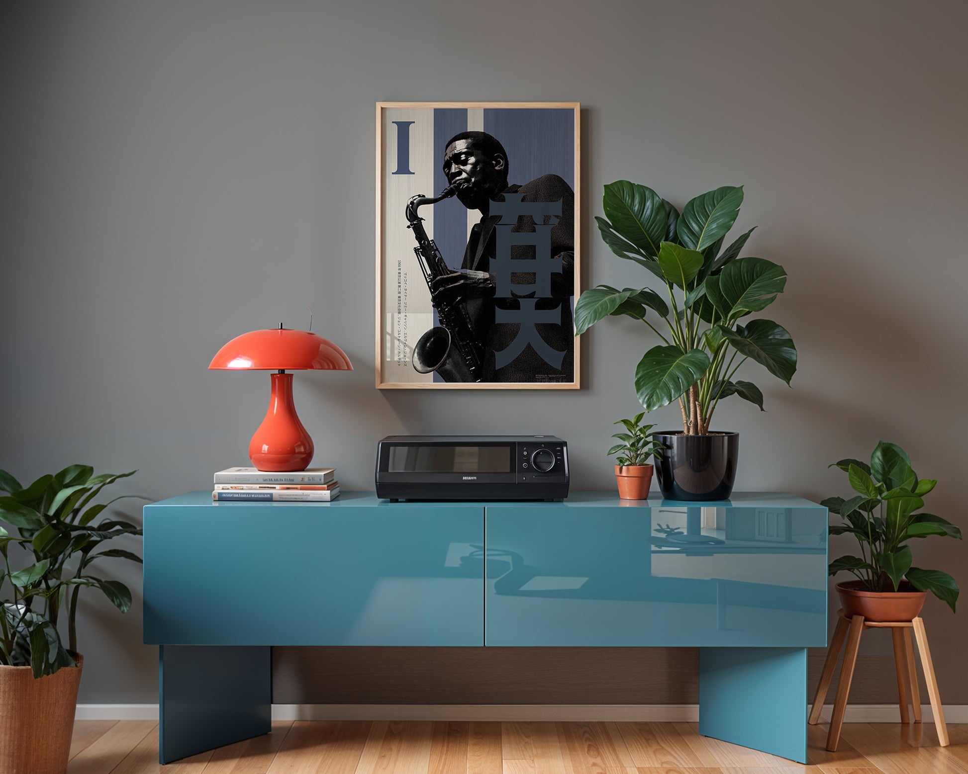Modern interior with a blue console table, red lamp, and framed artwork on a gray wall.