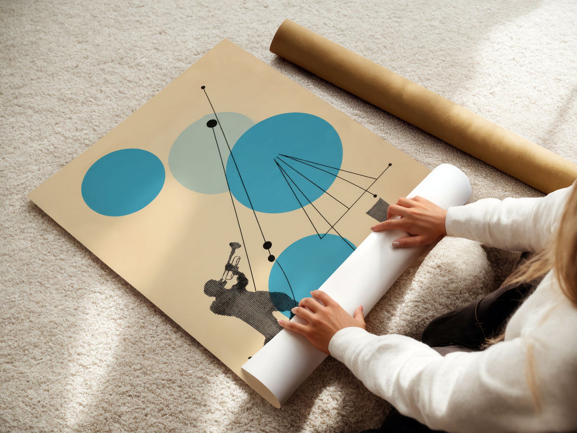 Person unrolling a large modern abstract poster with abstract design on a carpeted floor