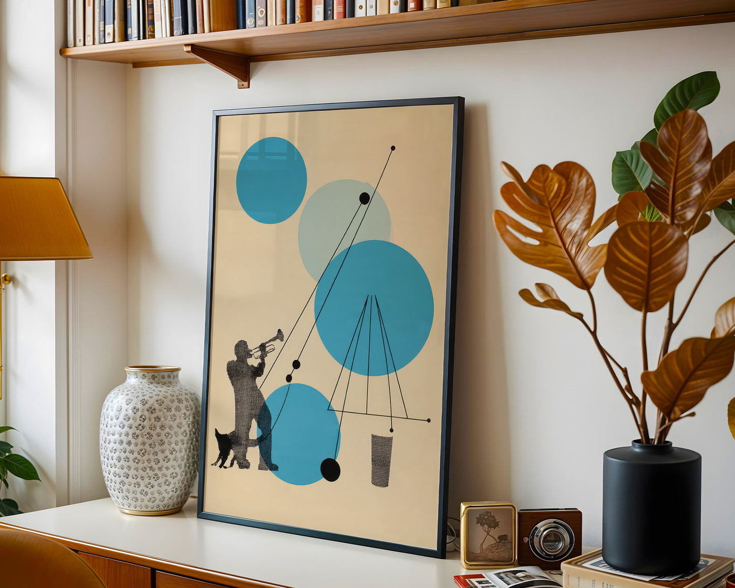 Framed abstract art piece on a shelf with decorative items