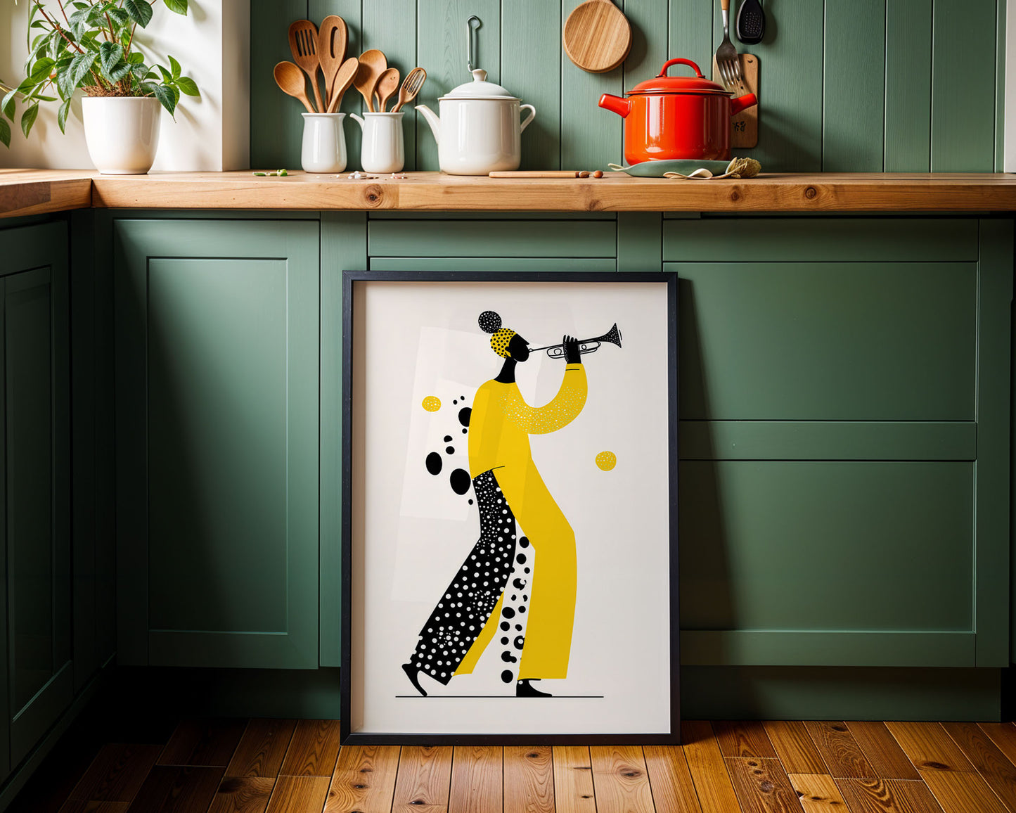 Framed artwork of a woman playing a trumpet in a kitchen setting with green cabinets and wooden countertops.