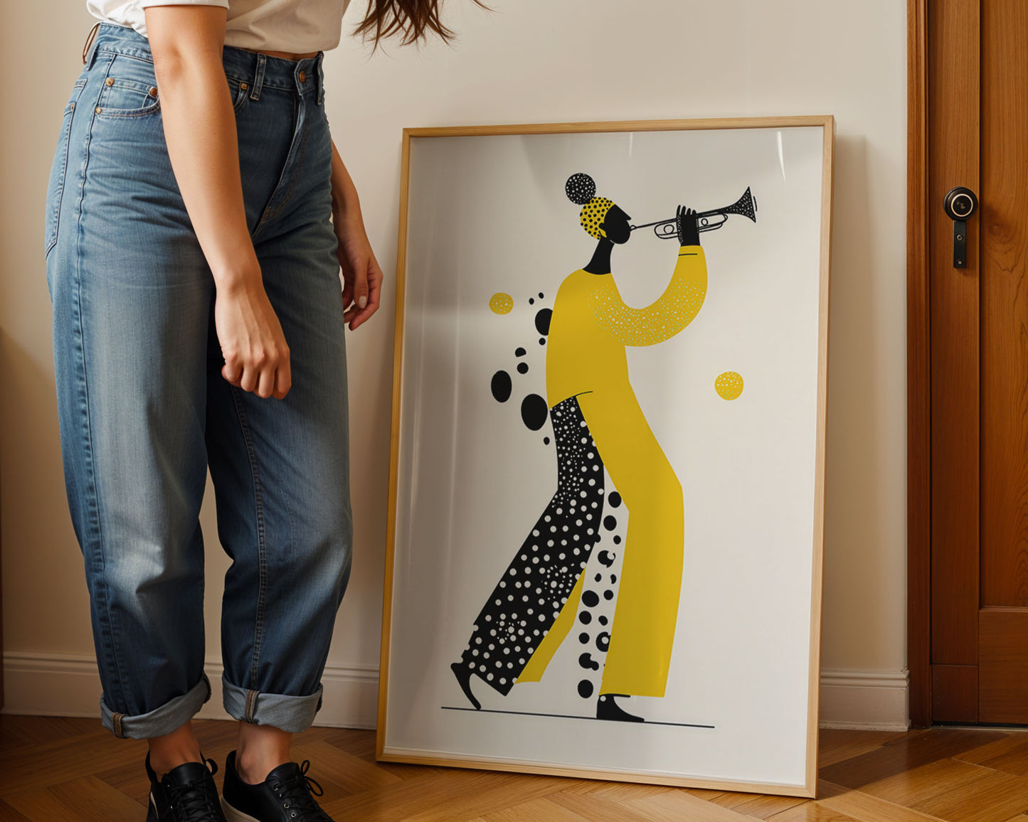 Person standing next to a framed artwork of a person playing a trumpet.