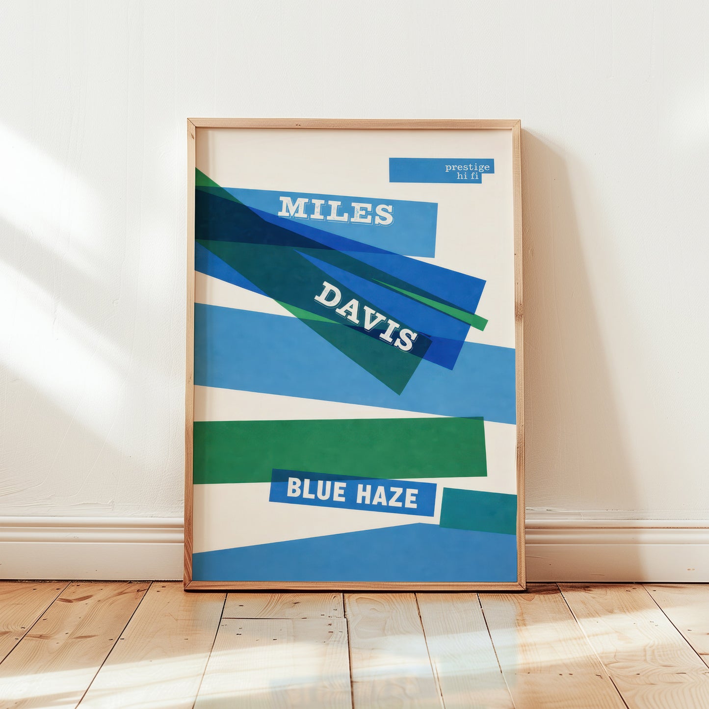 Framed poster of Miles Davis' 'Blue Haze' album cover on a white wall.
