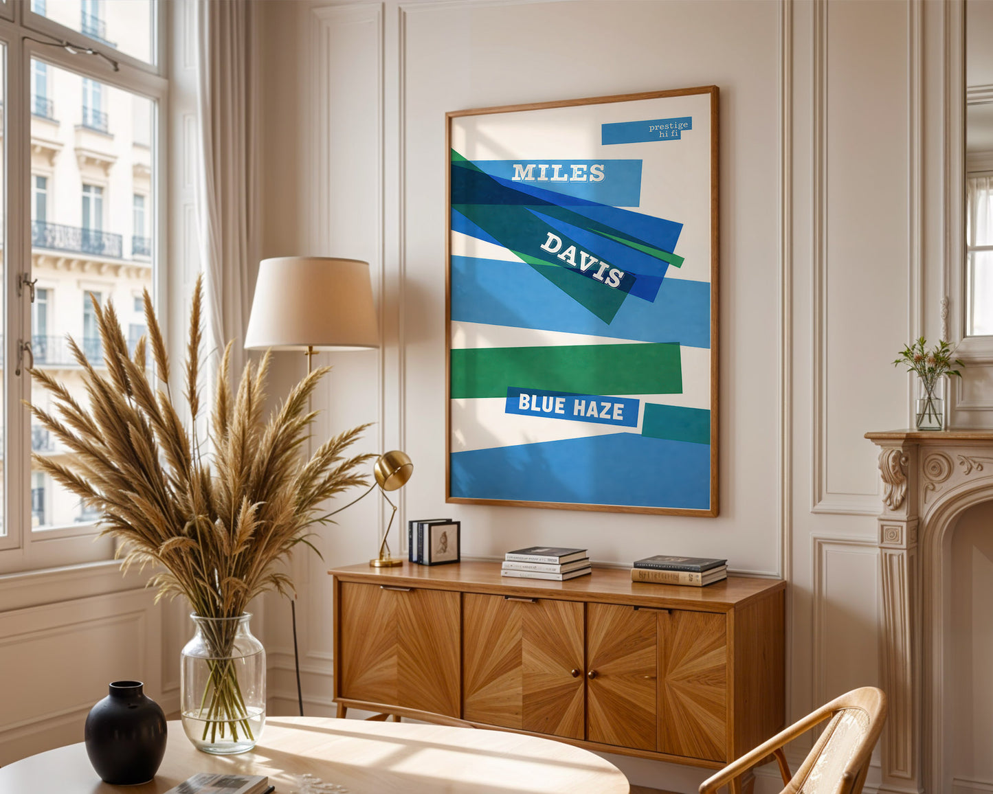 Living room with a framed Miles Davis poster, wooden cabinet, and decorative items.