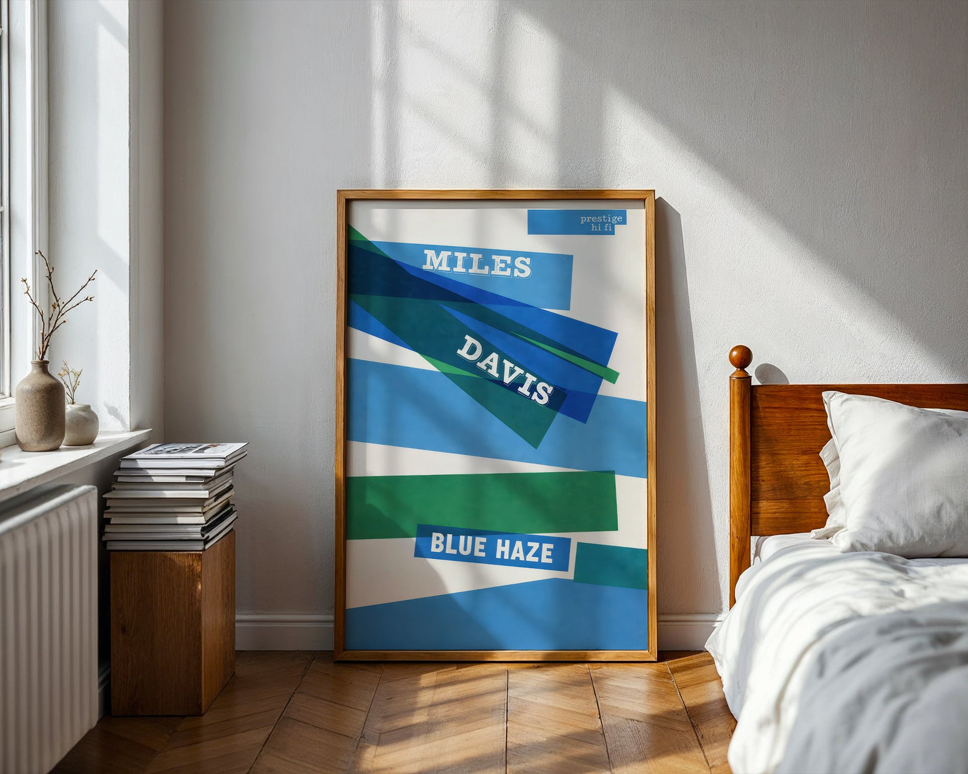 Framed Miles Davis 'Blue Haze' album cover in a bedroom setting