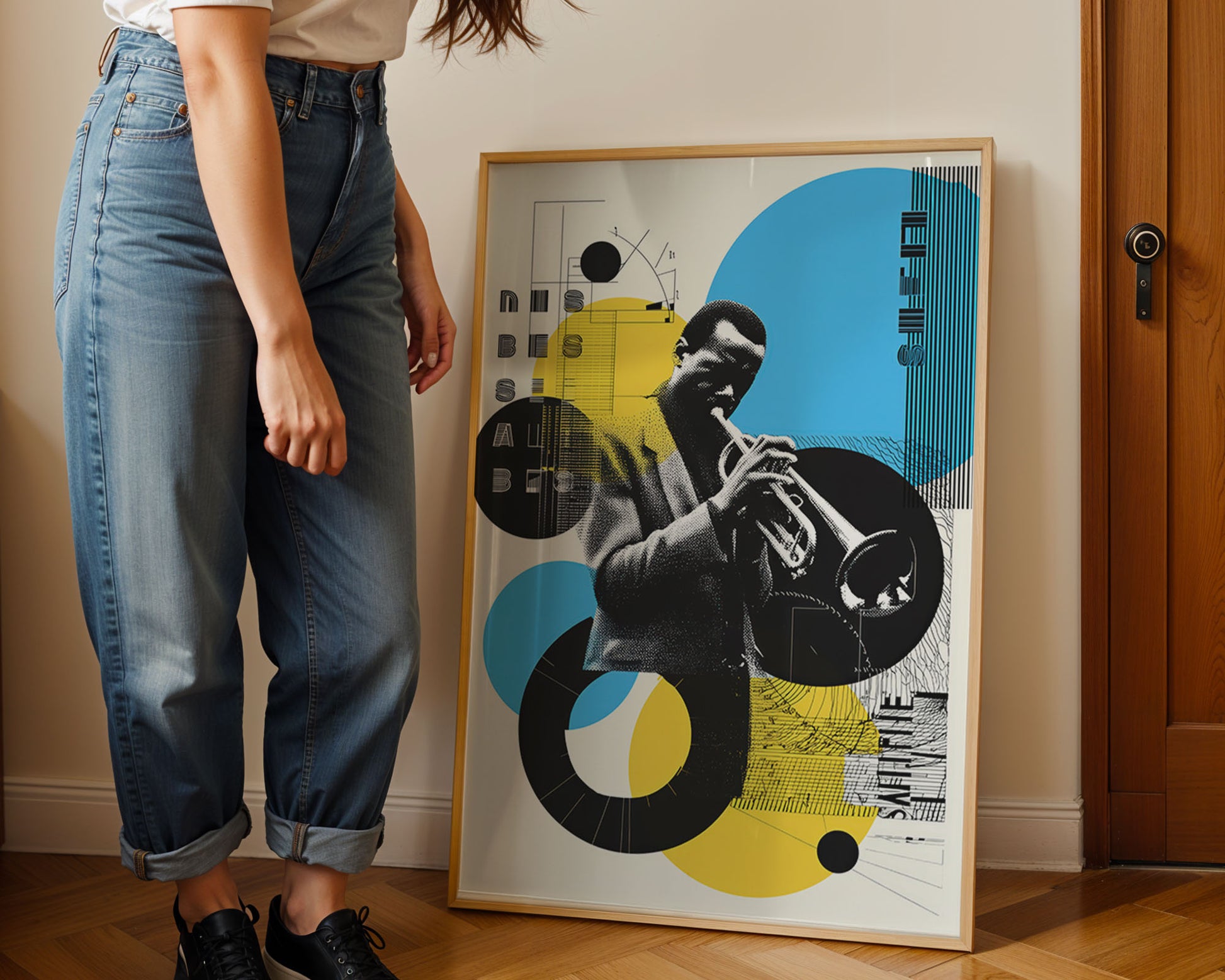 Person standing next to a framed poster of a jazz musician playing a trumpet.