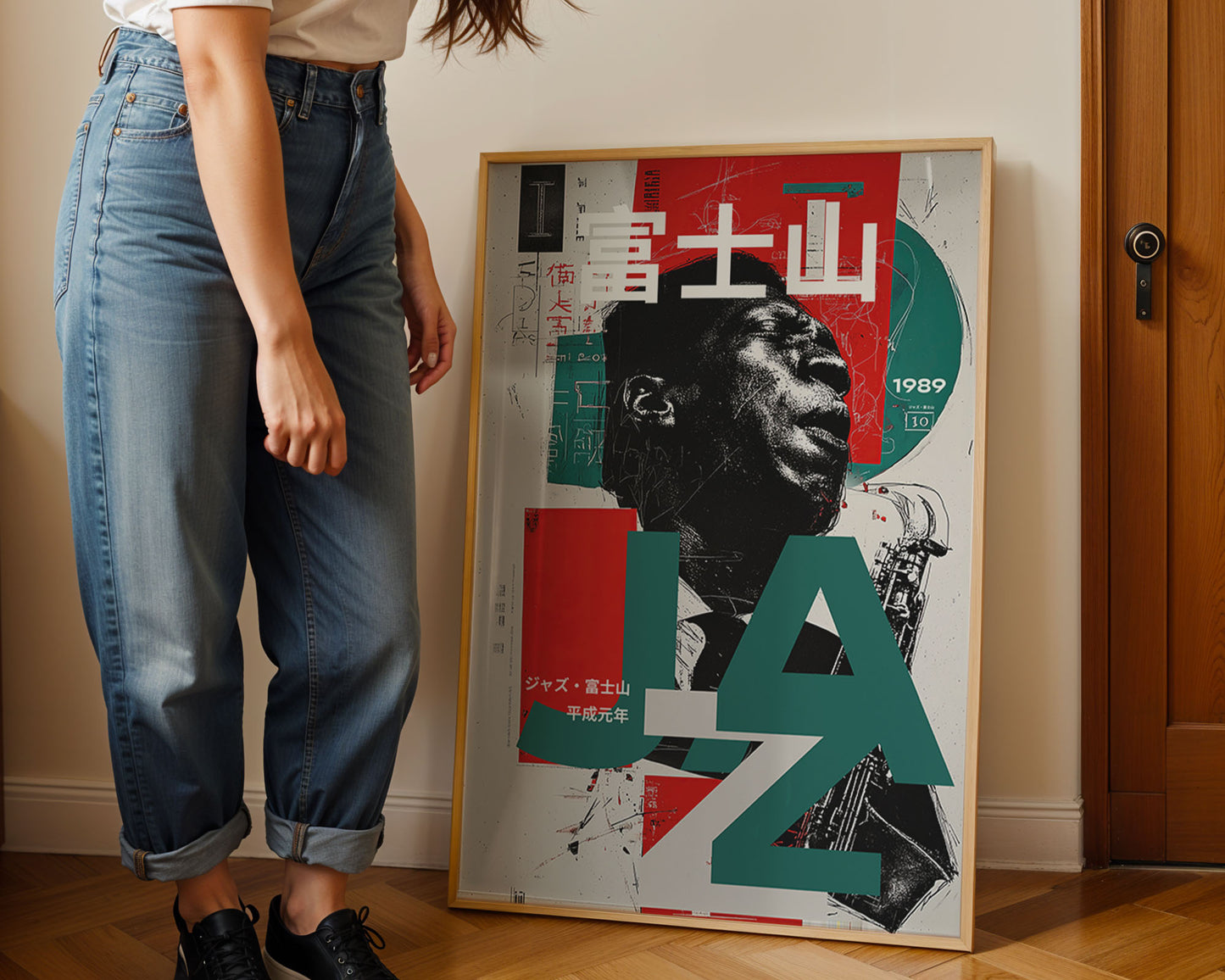 Person standing next to a colorful framed poster on a wall.