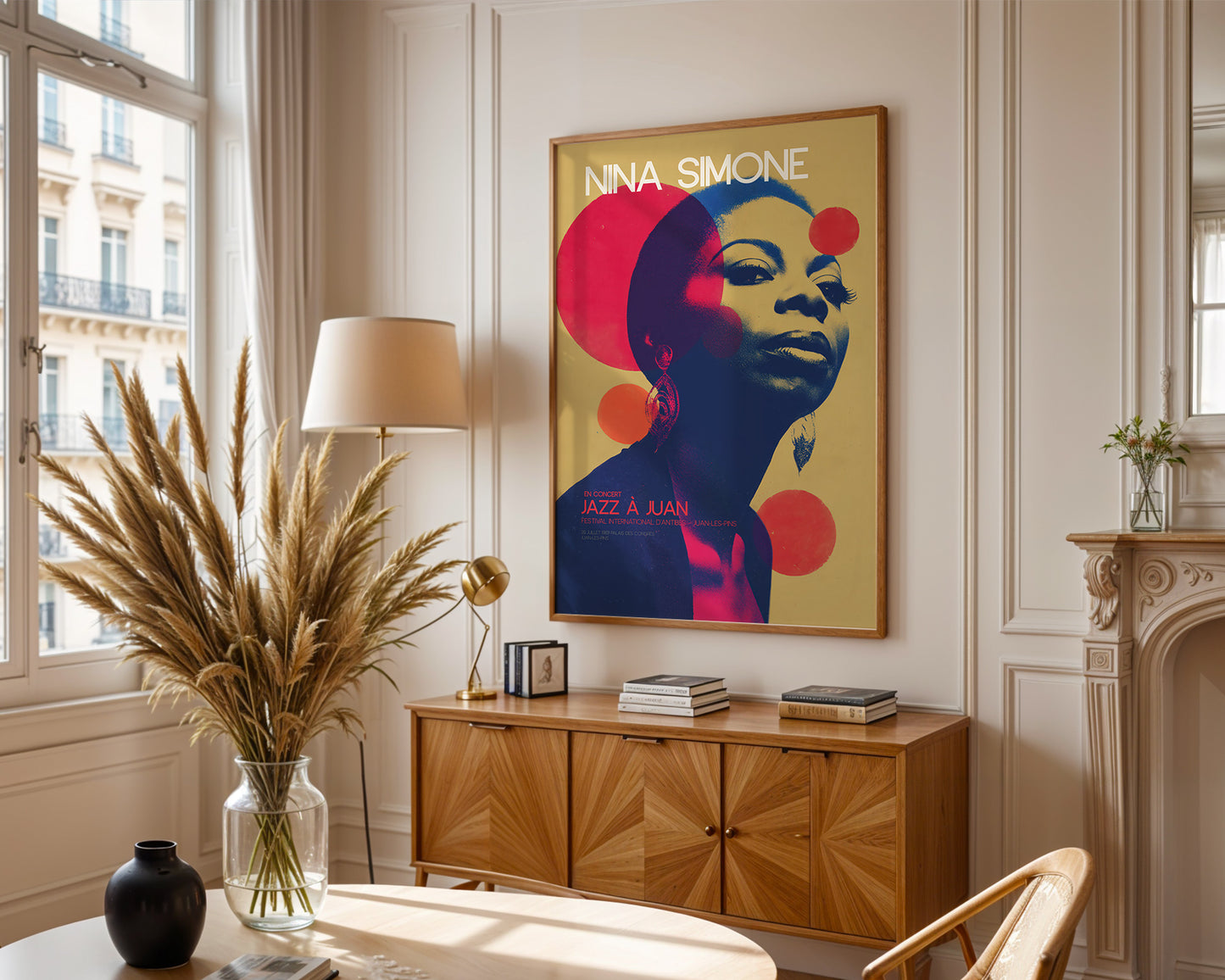 Living room with a framed poster of Nina Simone, wooden cabinet, and decorative items.