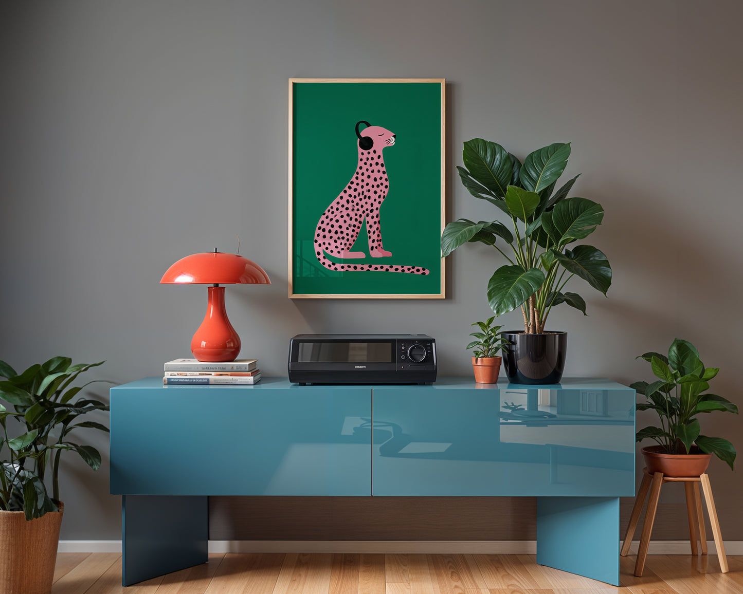 maximalist wall art interior with a blue console table, red lamp, and framed artwork on a gray wall.