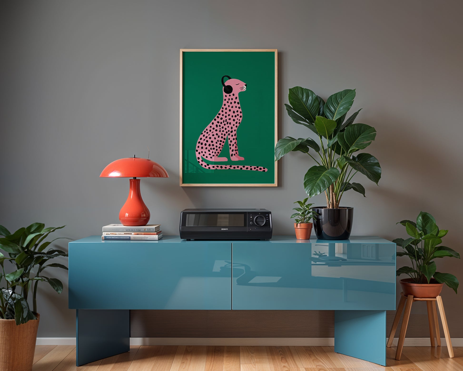 maximalist wall art interior with a blue console table, red lamp, and framed artwork on a gray wall.