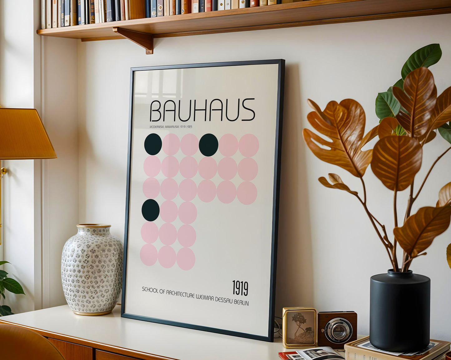 Framed Bauhaus poster on a shelf with decorative items