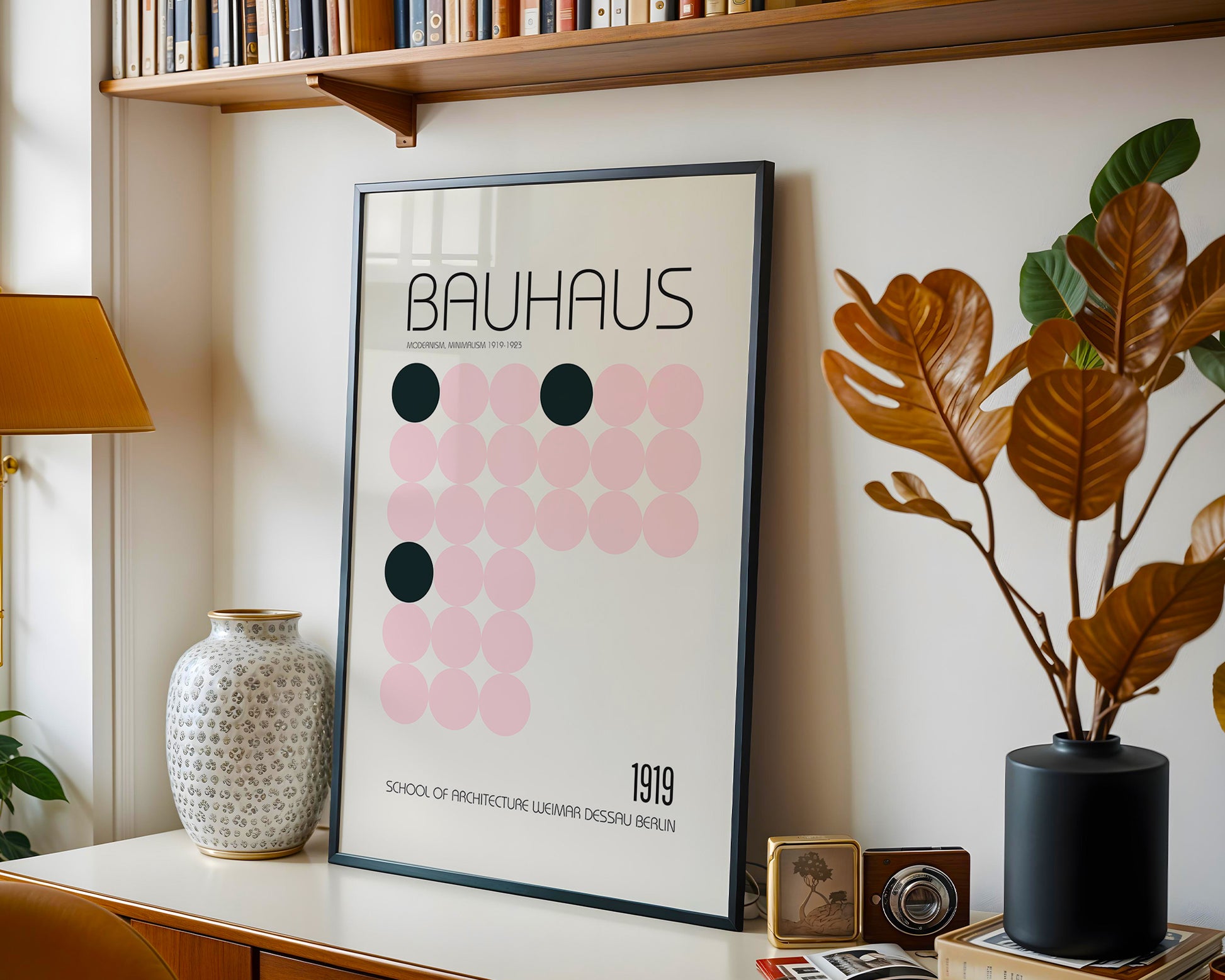 Framed Bauhaus poster on a shelf with decorative items