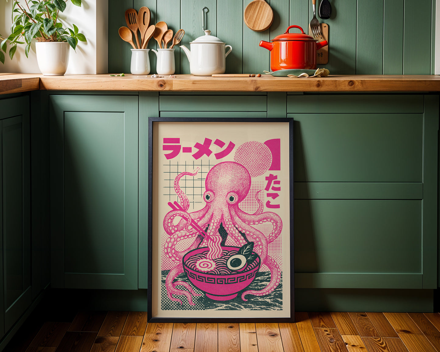 Framed pink octopus print with Japanese text on a kitchen wall