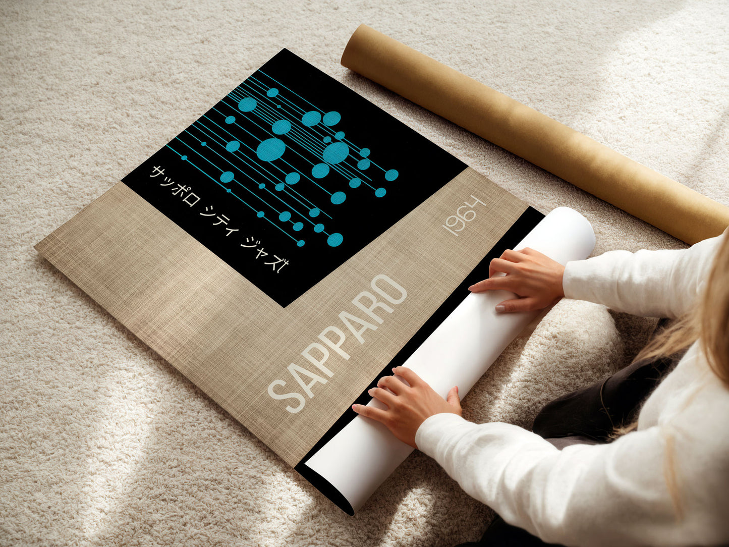 Person unrolling a Sapporo mat with branding on a light-colored floor.
