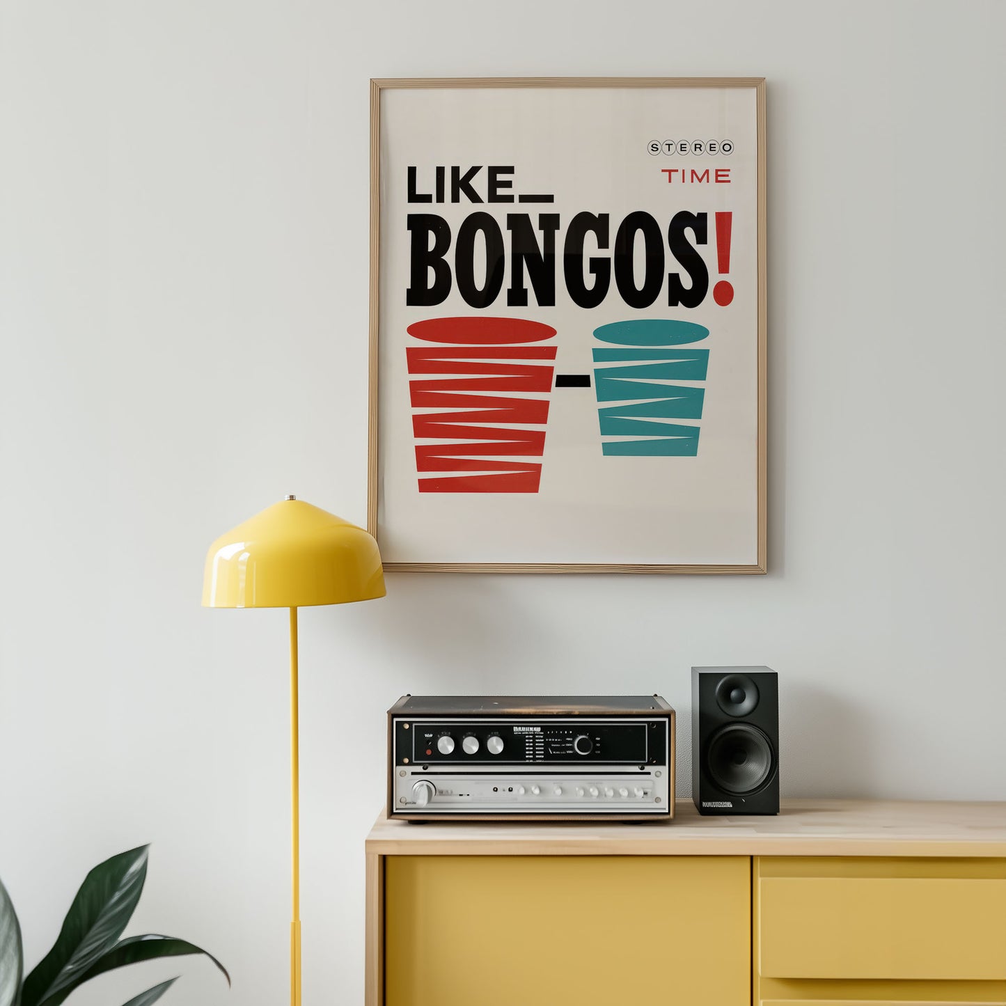 Framed poster with 'Like Bongos!' text above a yellow cabinet with stereo equipment.