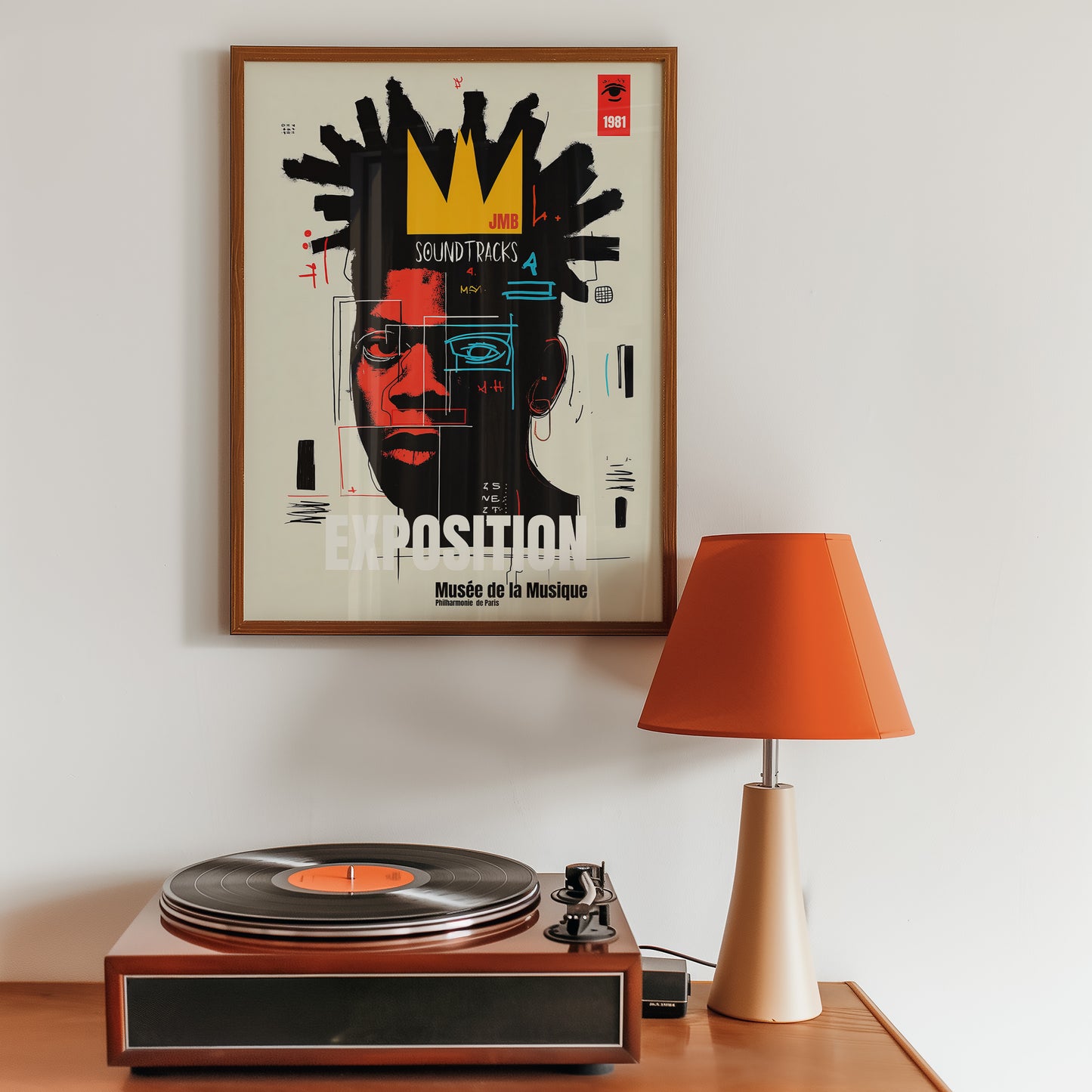 Framed poster on a wall above a record player with an orange lamp.