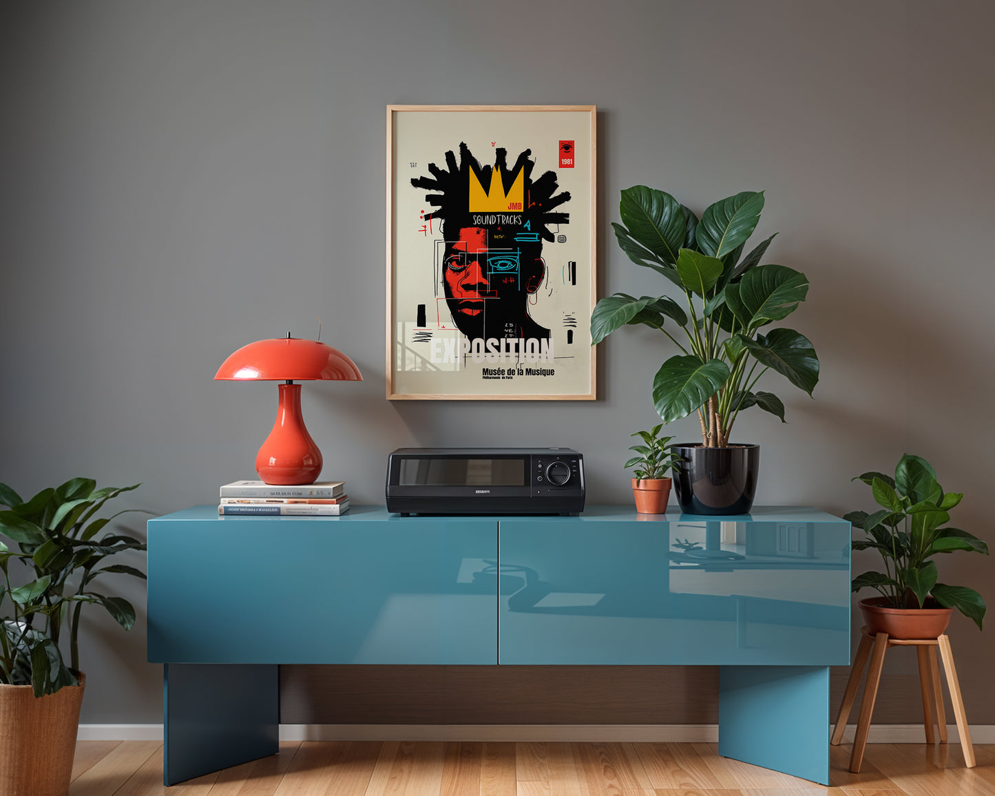 Modern french interior with a blue console table, red lamp, and framed artwork on a gray wall.
